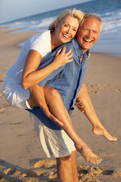 Margaritaville - Section Column Images - Happy elderly couple on the beach